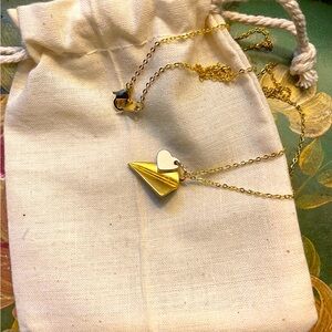 NWOT gold tone paper airplane necklace